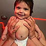 Genesis Andrea Muñoz is registered to the contest to win money with this photo: baby, smile, hands, diaper, indoor, child, cute, skin, face, person, happy, expression, infant, holding, red_led_lights, room, background, human, toddler, cheeks