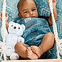 Montrice joined the competition — help win amazing prizes! baby, blanket, blue, child, childhood, cozy, cute, denim_overalls, feet, hands, indoor, infant, looking_at_camera, plush_toy, portrait, relaxed, smiling, soft_texture, swing, teddy_bear