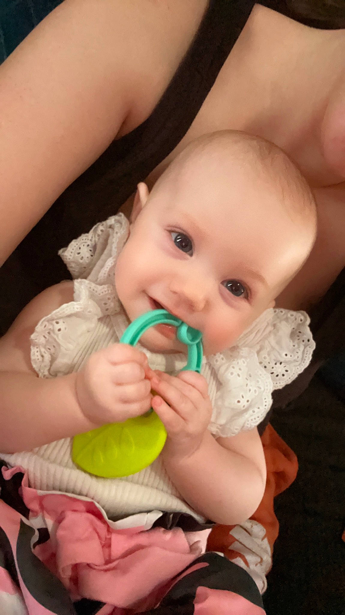 Serenity is registered to the contest to win money with this photo: arm, baby, baby_toddler_clothing, cheek, chin, dress, eye, eyelash, finger, gesture, happy, human_body, iris, lip, mouth, nail, nose, person, skin, thumb