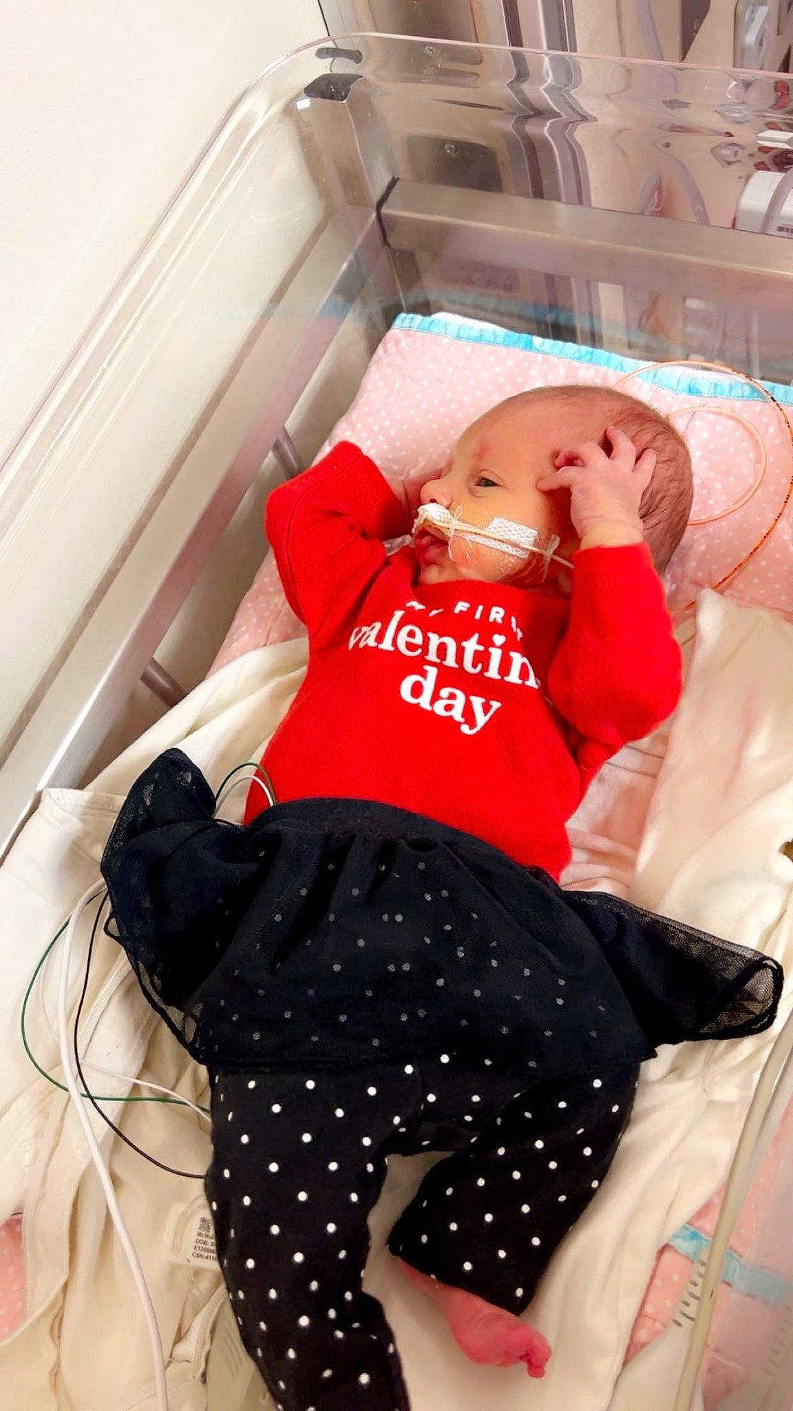 Oakley is registered to the contest to win money with this photo: abdomen, bedding, comfort, elbow, event, hat, human_leg, knee, leg, linens, medical_equipment, pattern, person, shorts, sleeve, sportswear, t_shirt, textile, thigh, trunk