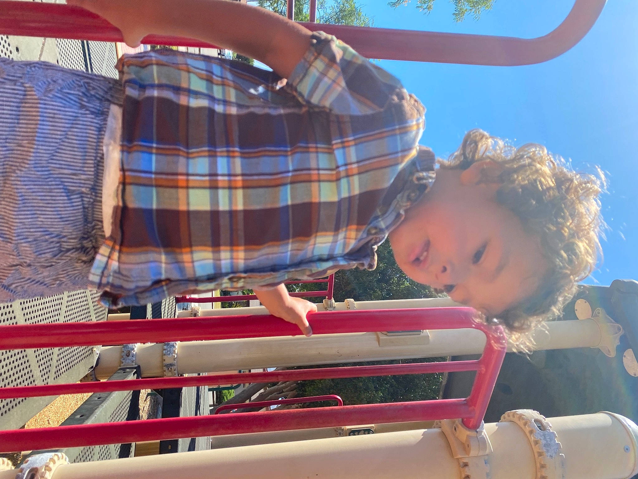 Benicio is registered to the contest to win money with this photo: child, city, event, fun, grass, happy, leisure, pattern, person, plaid, recreation, sitting, sky, summer, tartan, toddler, travel, tree, vacation