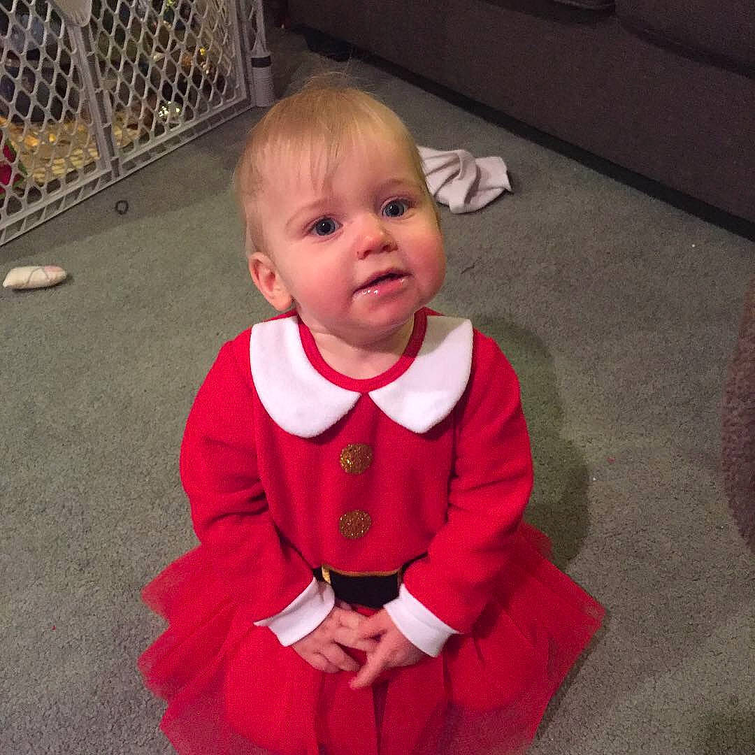 Brooklyn is registered to the contest to win money with this photo: boy, child, christmas, costume, day, fun, girl, holiday, infant, outerwear, person, product, red, skin, smile, standing, toddler