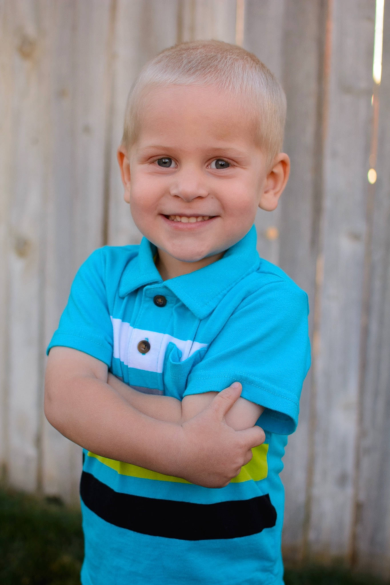 Charlie is registered to the contest to win money with this photo: abdomen, blue, boy, cheek, child, child_model, eye, facial_expression, fun, girl, green, happiness, infant, joy, person, portrait_photography, product, skin, smile, standing