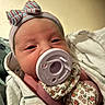 Za'Mora joined the competition — help win amazing prizes! newborn, baby, pacifier, headband, bow, blanket, mittens, floral_pattern, close_up, infant, sleepy, wrapped, soft_lighting, cute, portrait, child, face, skin, indoors, cozy