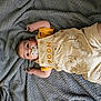 baby, infant, pacifier, blanket, clothing, yellow, winnie_the_pooh, cute, soft_texture, lying_down, child, face, portrait, indoors, comfort, sleepwear, happy, skin, small_hands, baby_outfit