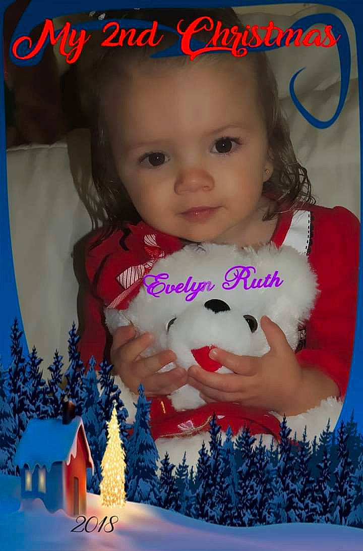 Evelyn is registered to the contest to win money with this photo: blue, cheek, child, christmas, day, facial_expression, fun, girl, happiness, holiday, infant, person, photomontage, play, product, red, skin, smile, toddler