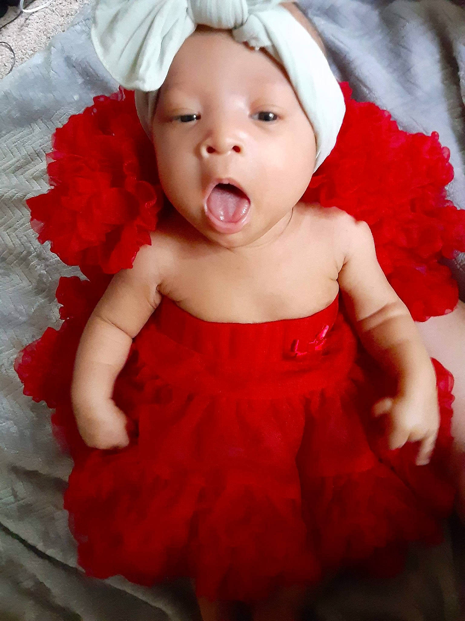 Kataleya joined the competition — help win amazing prizes! baby, cheek, child, child_model, costume, eye, facial_expression, hair_accessory, head, headgear, headwear, lip, mouth, nose, person, petal, pink, product, red, skin