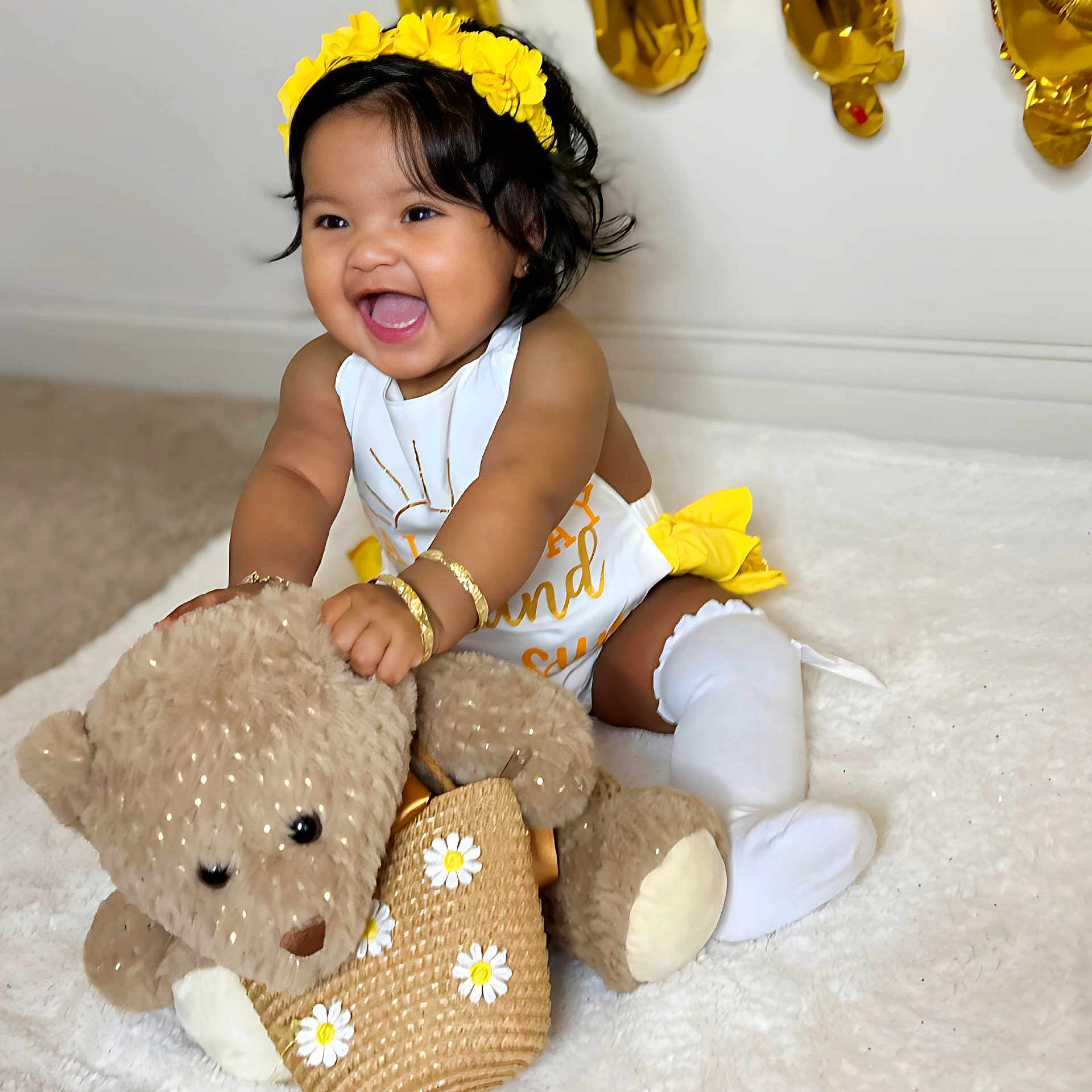 Bella is registered to the contest to win money with this photo: accessories, baby, babylaughing, clothing, couch, dress, face, furniture, happy, head, jewelry, laughing, necklace, person, photography, portrait, sitting, smile, teddybear, toy