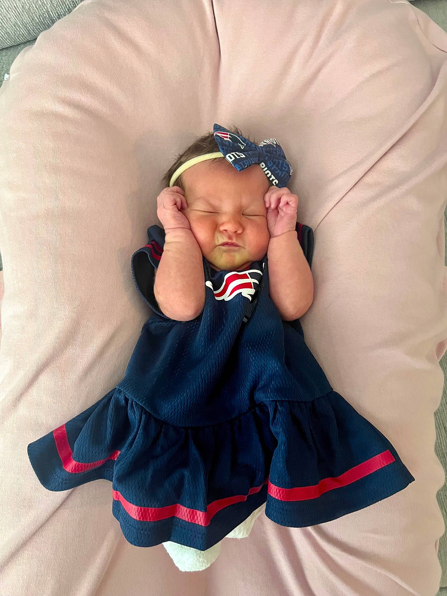 Delaney is registered to the contest to win money with this photo: baby, baby_products, baby_toddler_clothing, comfort, costume, costume_accessory, costume_hat, day_dress, electric_blue, fashion_accessory, hair_accessory, headband, headpiece, jewellery, linens, magenta, pattern, person, sitting, sleeve