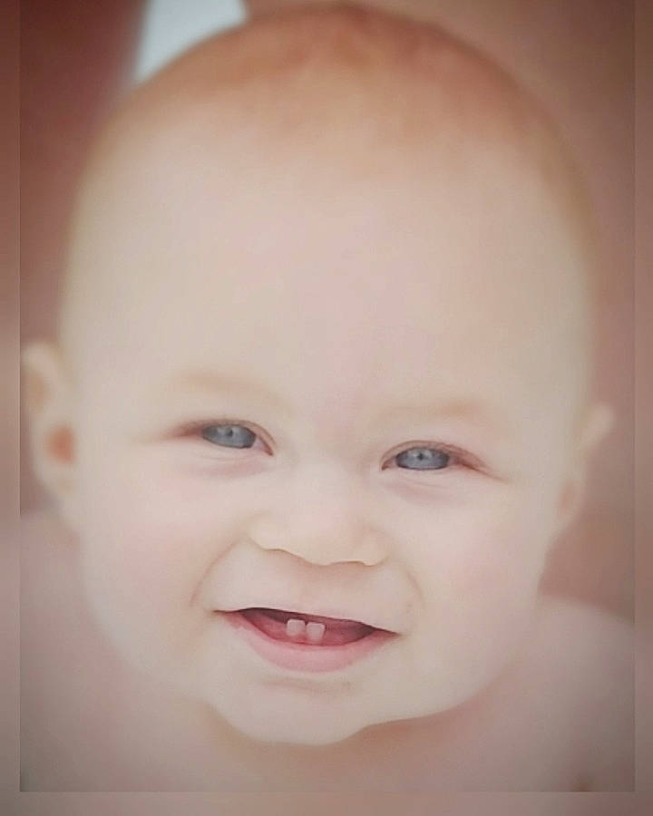 Sebastian is registered to the contest to win money with this photo: baby, beauty, cheek, child, chin, close_up, eye, eyebrow, face, facial_expression, forehead, head, lip, mouth, nose, organ, person, photograph, skin, smile