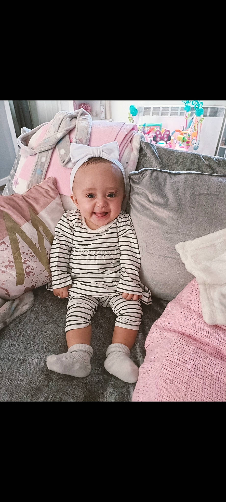 Myah joined the competition — help win amazing prizes! baby, baby_toddler_clothing, child, comfort, eye, face, happy, head, joy, linens, pattern, person, pink, product, sitting, skin, sleeve, smile, sock, t_shirt