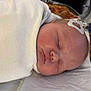 Wolfgang joined the competition — help win amazing prizes! newborn, baby, swaddled, sleeping, infant, hospital, medical_sensor, blanket, bed, face, head, healthcare, patient, rest, peaceful, indoors, soft, wrapped, closeup, child