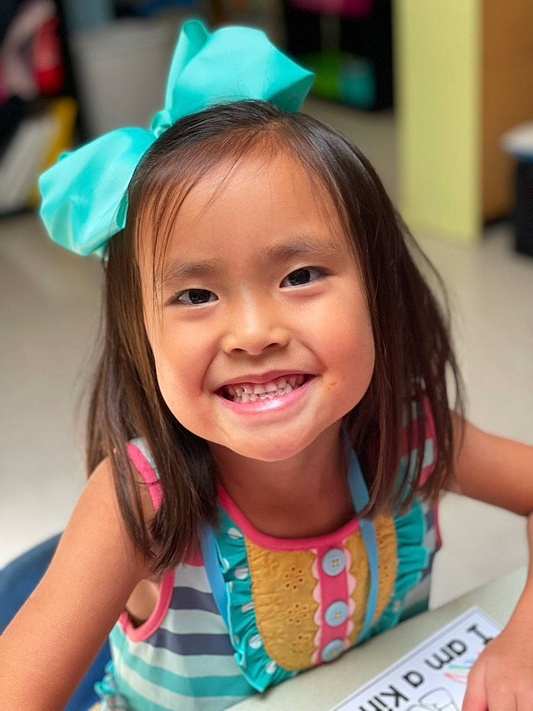 Kenlee joined the competition — help win amazing prizes! birthday, child, costume_hat, event, eyelash, face, fashion_accessory, fun, green, happy, headpiece, iris, joy, leisure, party_hat, person, pink, product, skin, smile