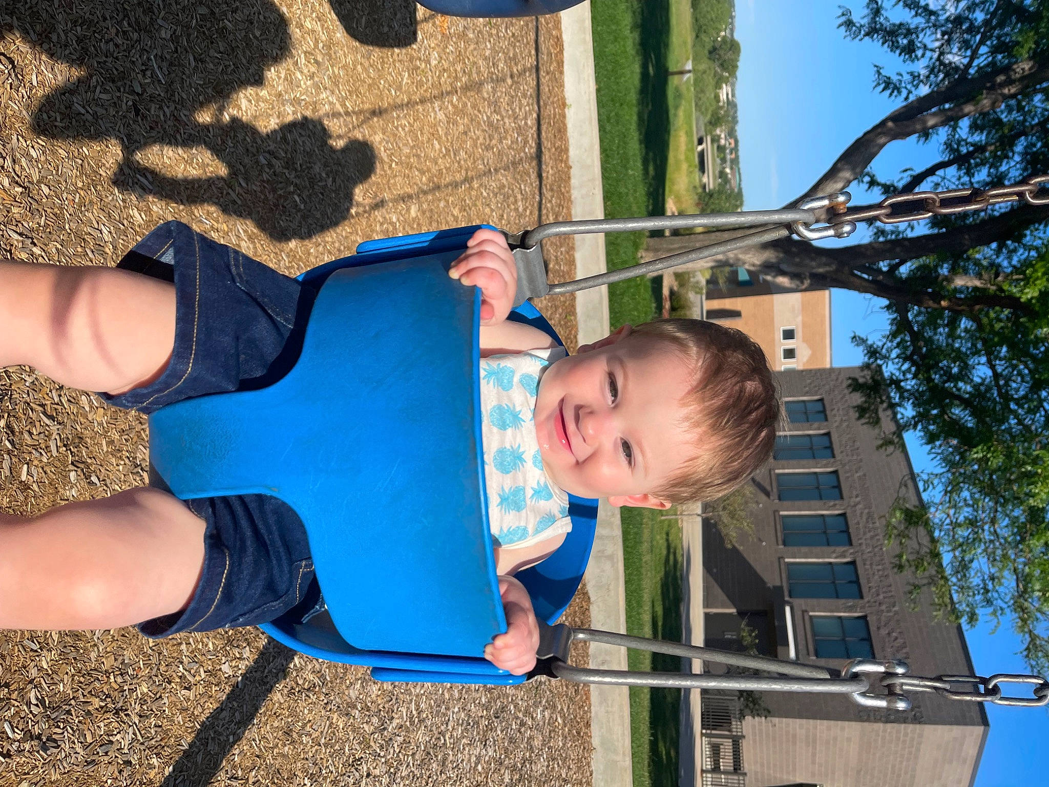 Keenan is registered to the contest to win money with this photo: azure, baby_toddler_clothing, blue, child, city, electric_blue, fun, happy, human_leg, joy, leaf, leisure, line, people_in_nature, person, recreation, sky, smile, t_shirt, thigh