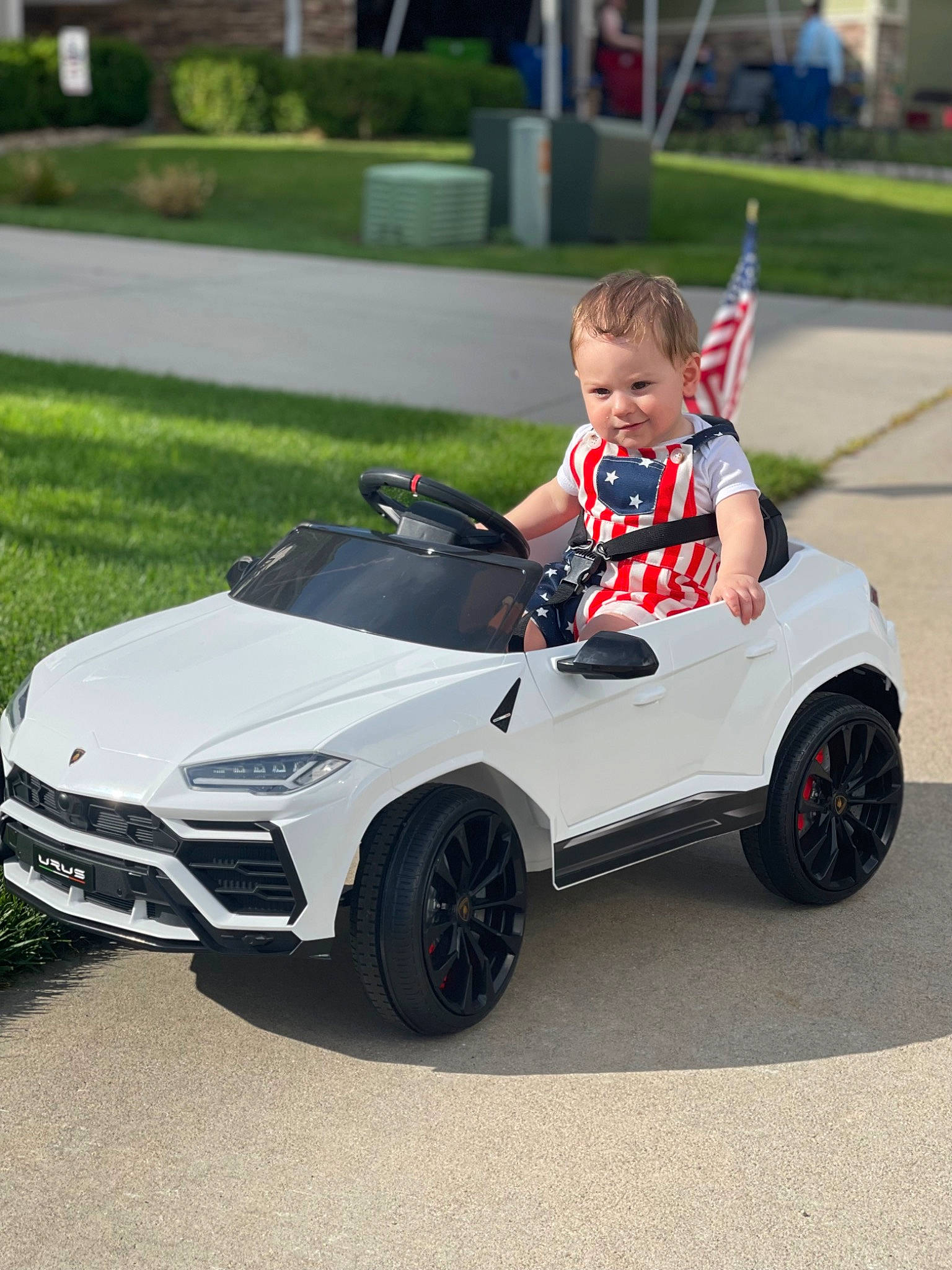 Keenan is registered to the contest to win money with this photo: alloy_wheel, auto_part, automotive_design, automotive_exterior, automotive_lighting, automotive_tire, automotive_wheel_system, bumper, car, fender, grass, hood, motor_vehicle, person, personal_luxury_car, plant, rim, tire, vehicle, vehicle_registration_plate