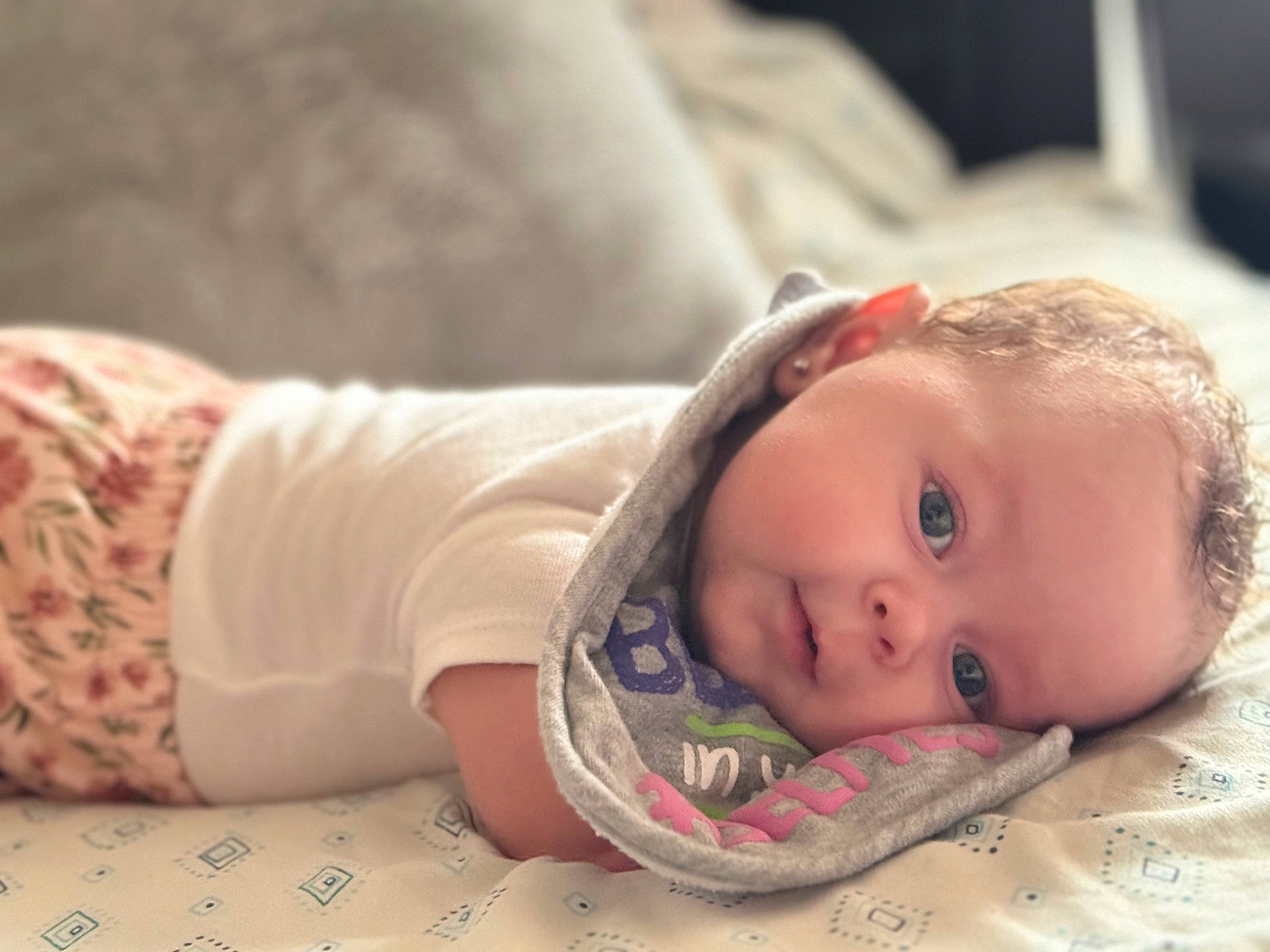 Annalise joined the competition — help win amazing prizes! baby, baby_toddler_clothing, cheek, child, comfort, eyelash, flash_photography, flooring, happy, human_body, linens, lip, nose, person, portrait_photography, room, sitting, skin, sleeve, toddler
