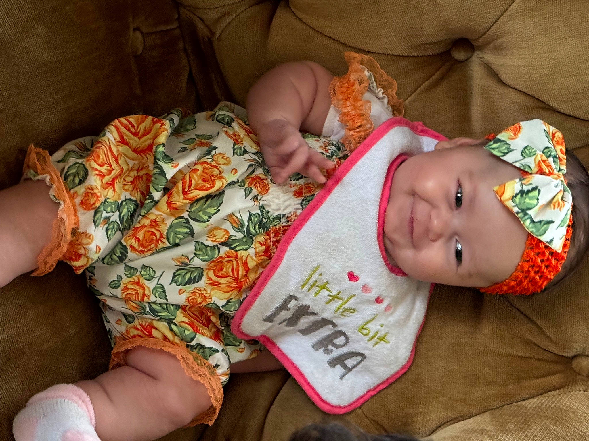 Annalise is registered to the contest to win money with this photo: baby, baby_toddler_clothing, child, comfort, eye, finger, foot, hand, head, headwear, human_body, human_leg, joy, knee, mouth, nail, pattern, person, skin, textile