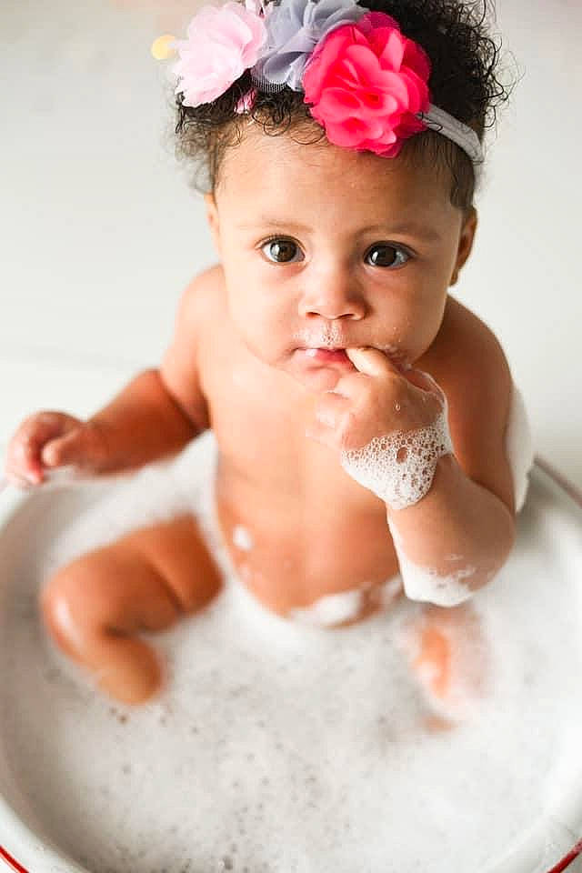 Kimora joined the competition — help win amazing prizes! baby, baby_bathing, bathing, bathtub, child, costume, face, fashion_accessory, hair_accessory, headband, headgear, headpiece, person, photography, pink, skin, toddler