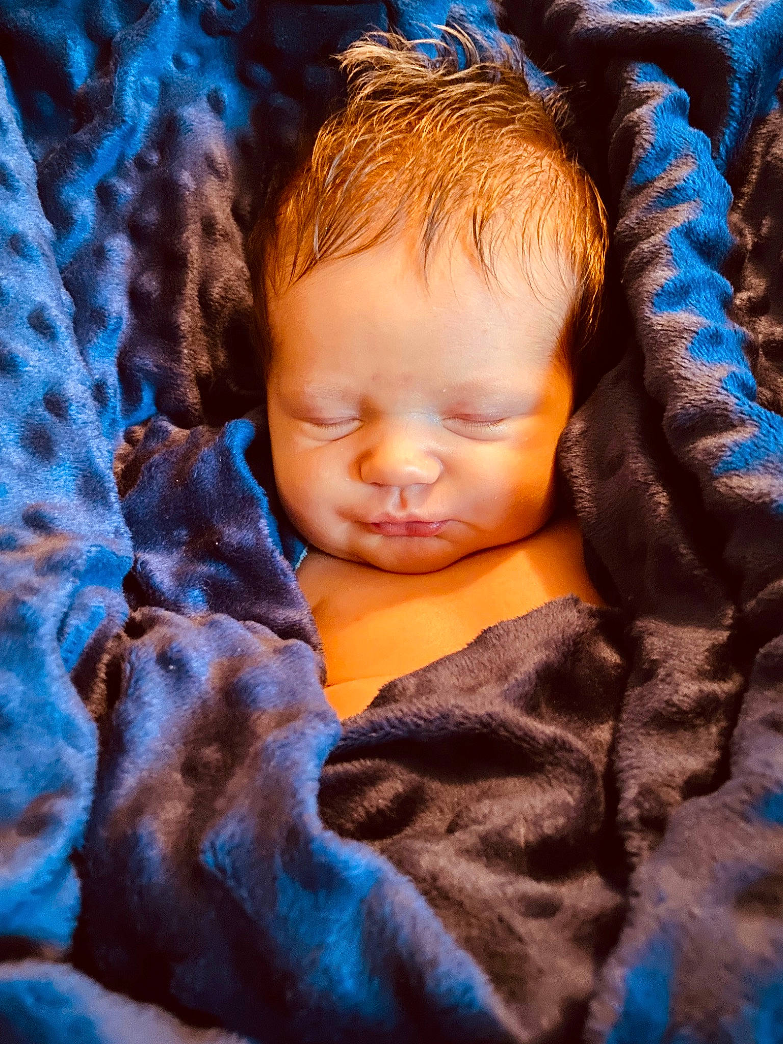 Tyler is registered to the contest to win money with this photo: azure, baby, blue, cheek, child, close_up, comfort, electric_blue, eyebrow, flash_photography, happy, iris, linens, nose, orange, pattern, people_in_nature, person, skin, toddler