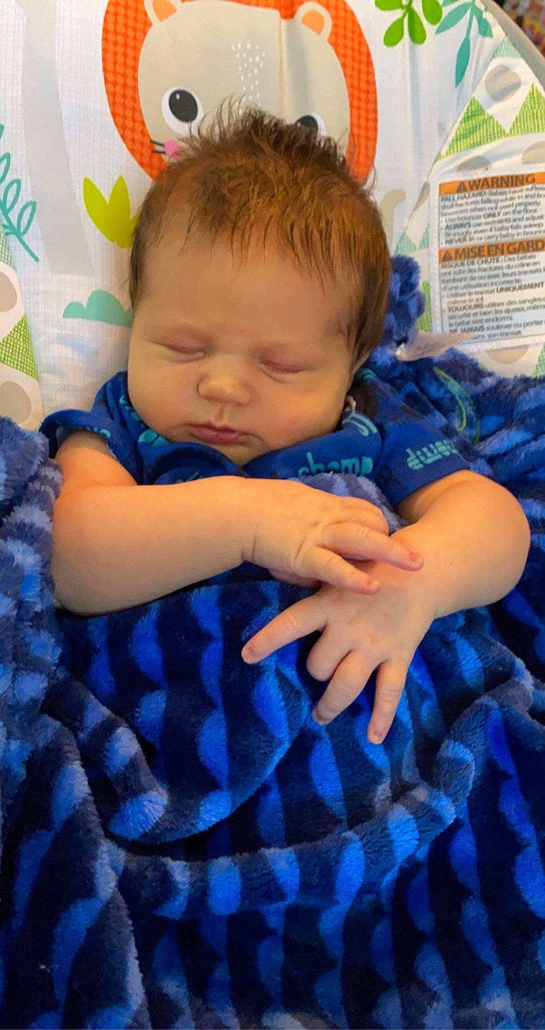 Tyler is registered to the contest to win money with this photo: azure, baby, baby_toddler_clothing, blue, cheek, child, comfort, electric_blue, finger, happy, iris, linens, pattern, person, plaid, sitting, skin, sleeve, tartan, textile