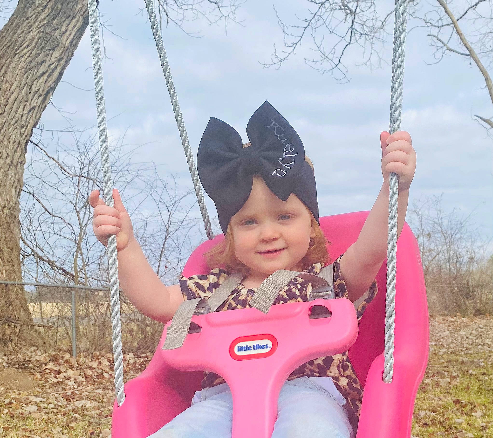 Kaelyn joined the competition — help win amazing prizes! beauty, cloud, fun, glove, grass, happy, hat, headwear, joy, leisure, magenta, people_in_nature, person, photograph, pink, plant, recreation, sky, smile, swing