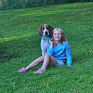 Buddy joined the competition — help win amazing prizes! child, dog, grass, outdoor, smiling, leash, collar, greenery, casual_clothing, happy, summer, nature, pet, friendship, sitting, yard, fence, sunlight, playful, relaxation