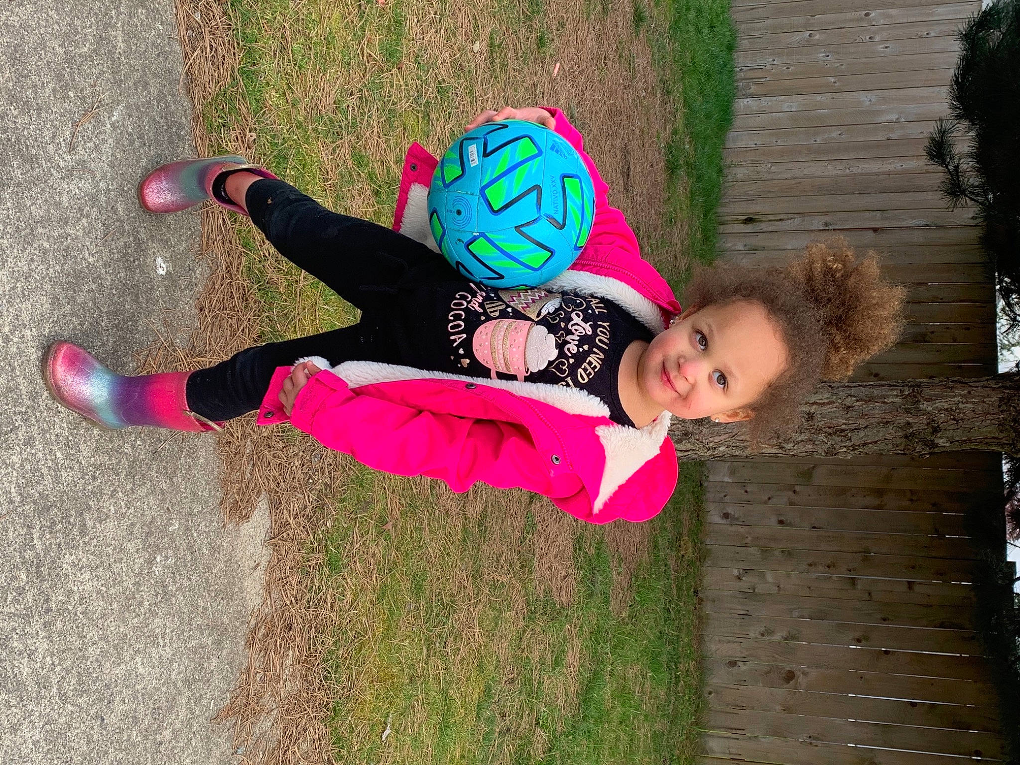 Zamora is registered to the contest to win money with this photo: active_pants, baby_toddler_clothing, boot, child, fun, grass, happy, joy, leg, leisure, magenta, pattern, people_in_nature, person, pink, plant, recreation, smile, thigh, toddler