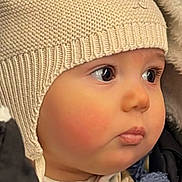 Marceau participe au concours pour gagner de l'argent avec cette photo : baby, child, face, knitted_hat, ear_flaps, winter_clothing, coat, blue_blanket, closeup, cute, soft_skin, big_eyes, outdoor, warm, headwear, portrait, infant, baby_fashion, adorable, young_child