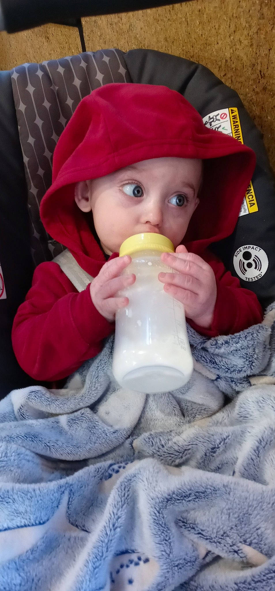 Kalvin is registered to the contest to win money with this photo: baby, baby_bottle, baby_products, baby_toddler_clothing, bottle, cap, cheek, child, drinking, drinkware, face, hat, headwear, milk, nose, person, plastic, plastic_bottle, skin, sleeve