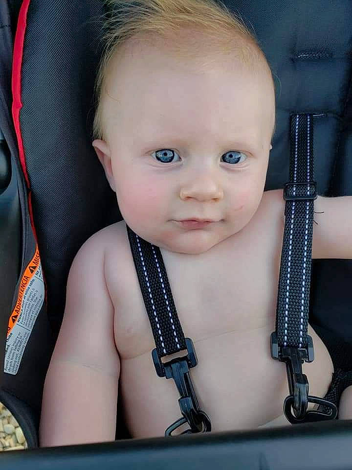 Vincent is registered to the contest to win money with this photo: baby, car_seat, cheek, child, eye, eyebrow, face, head, lip, nose, person, skin, smile, toddler