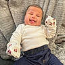 Harmony joined the competition — help win amazing prizes! baby, infant, child, smiling, happy, portrait, lying_down, blanket, gray_blanket, mittens, patterned_mittens, white_shirt, denim, pants, clothing, indoors, cozy, close_up, face, photography