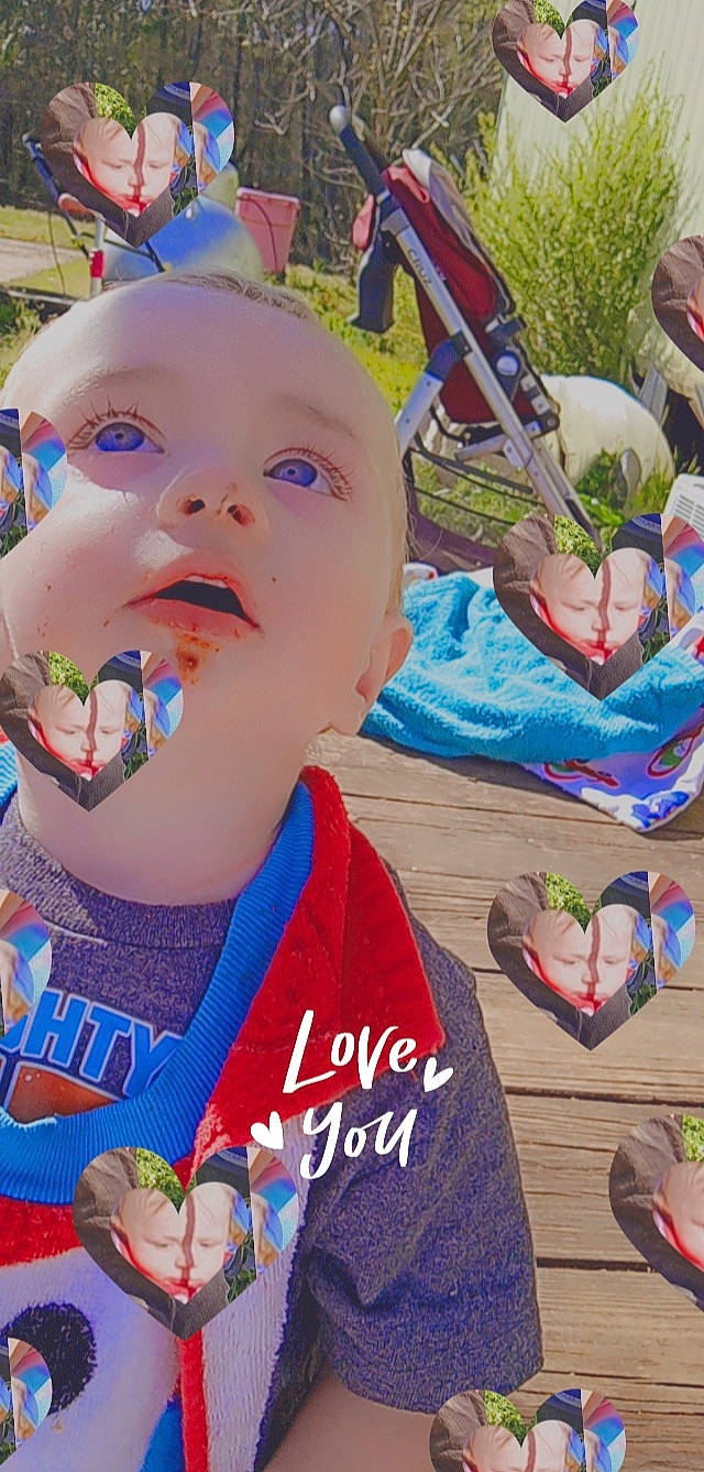 Hunter is registered to the contest to win money with this photo: baby, baby_products, baby_toddler_clothing, baby_toys, blue, child, electric_blue, event, fashion_accessory, fun, grass, happy, leisure, person, play, recreation, sitting, toddler, vacation