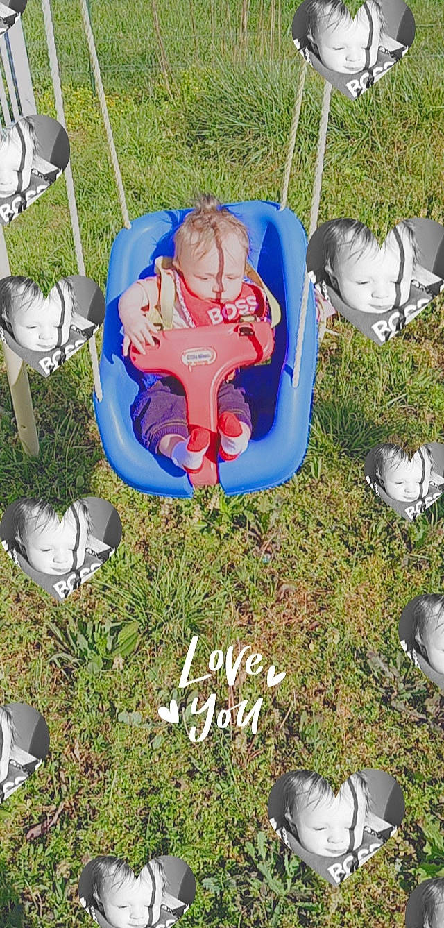 Jeffery is registered to the contest to win money with this photo: baby, baby_toddler_clothing, child, chute, electric_blue, fictional_character, fun, grass, inflatable, lawn_ornament, leisure, outdoor_play_equipment, person, plant, play, playground, recreation, shoe, sneakers, toddler