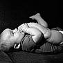 Christian joined the competition — help win amazing prizes! baby, infant, black_and_white, couch, foot_in_mouth, cute, child, diaper, indoors, portrait, happy, toddler, texture, relaxed, side_view, small_child, one_person, infant_clothing, baby_pose, human