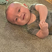 Christian joined the competition — help win amazing prizes! baby, carpet, smiling, infant, child, hands, plush_toy, wicker_basket, home_interior, floor, cute, person, lying_down, closeup, happy, indoors, soft_lighting, casual_clothing, head, skin