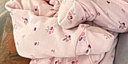 Lilah joined the competition — help win amazing prizes! arm, baby, cozy, cute, flooring, floral_pattern, hand, holding, human, indoor, infant, newborn, onesie, person, portrait, sleepwear, small, tattoo, wallpaper, wrapped