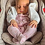 Lilah is registered to the contest to win money with this photo: adorable, baby, car_seat, child, closeup, cozy, cute, feet, floral_pattern, hands, indoors, infant, knitted, peaceful, pink_clothing, portrait, resting, sleeping, soft_fabric, white_sweater