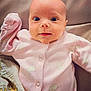 Lilah is registered to the contest to win money with this photo: adorable, baby, blanket, child, comfort, cute, face, head, indoors, infant, lying_down, newborn, person, pink_onesie, skin, sleepwear, smile, soft_fabric, warm, wide_eyes