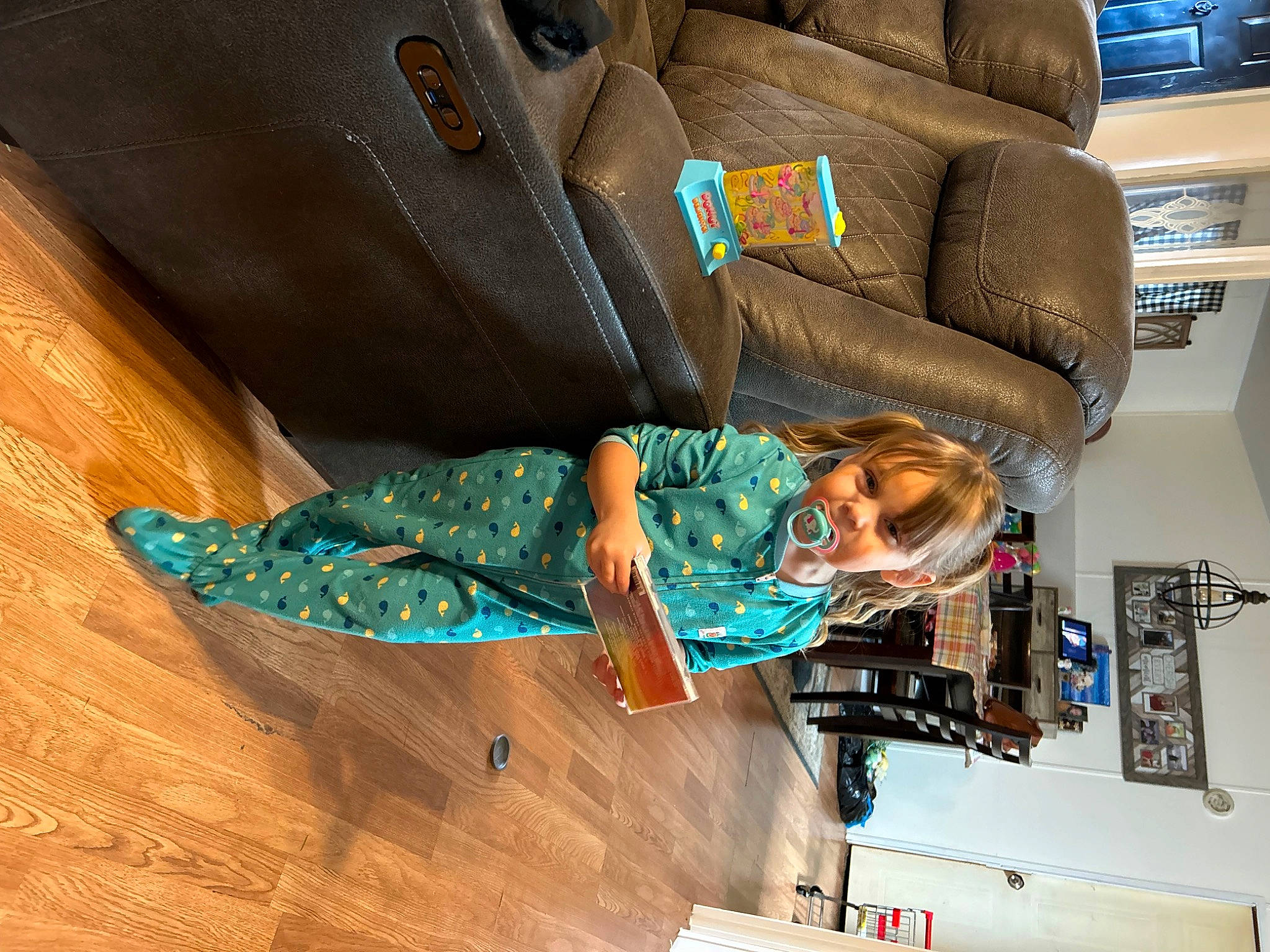 Natalee joined the competition — help win amazing prizes! airline, automotive_design, car_seat, car_seat_cover, comfort, couch, flooring, hardwood, head_restraint, leather, leisure, luxury_vehicle, machine, person, room, sitting, suit, vehicle_door, wood