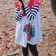 Brooklinn joined the competition — help win amazing prizes! autumn, child, cute, dress, fall, girl, ground, holiday_theme, leaves, leggings, nature, outdoor, phone, pigtails, playful, smiling, standing, striped_sleeves, white_shoes, young
