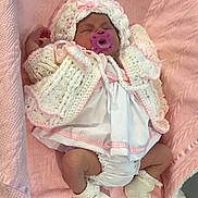 Esmè is registered to the contest to win money with this photo: baby, infant, pacifier, blanket, knitted_clothing, bonnet, sleeping, pink, white, cute, soft, newborn, sock, baby_clothes, resting, cozy, indoors, child, portrait, toddler