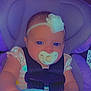Kaylee is registered to the contest to win money with this photo: baby, car_seat, pacifier, headband, flower, blanket, infant, child, seatbelt, clothing, hand, face, person, cute, indoor, portrait, comfort, safety, young, baby_girl