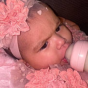 Avia is registered to the contest to win money with this photo: baby, bottle, feeding, headband, pink, lace, flower, closeup, infant, cute, child, face, portrait, soft, fabric, young, skin, eyes, mouth, clothing