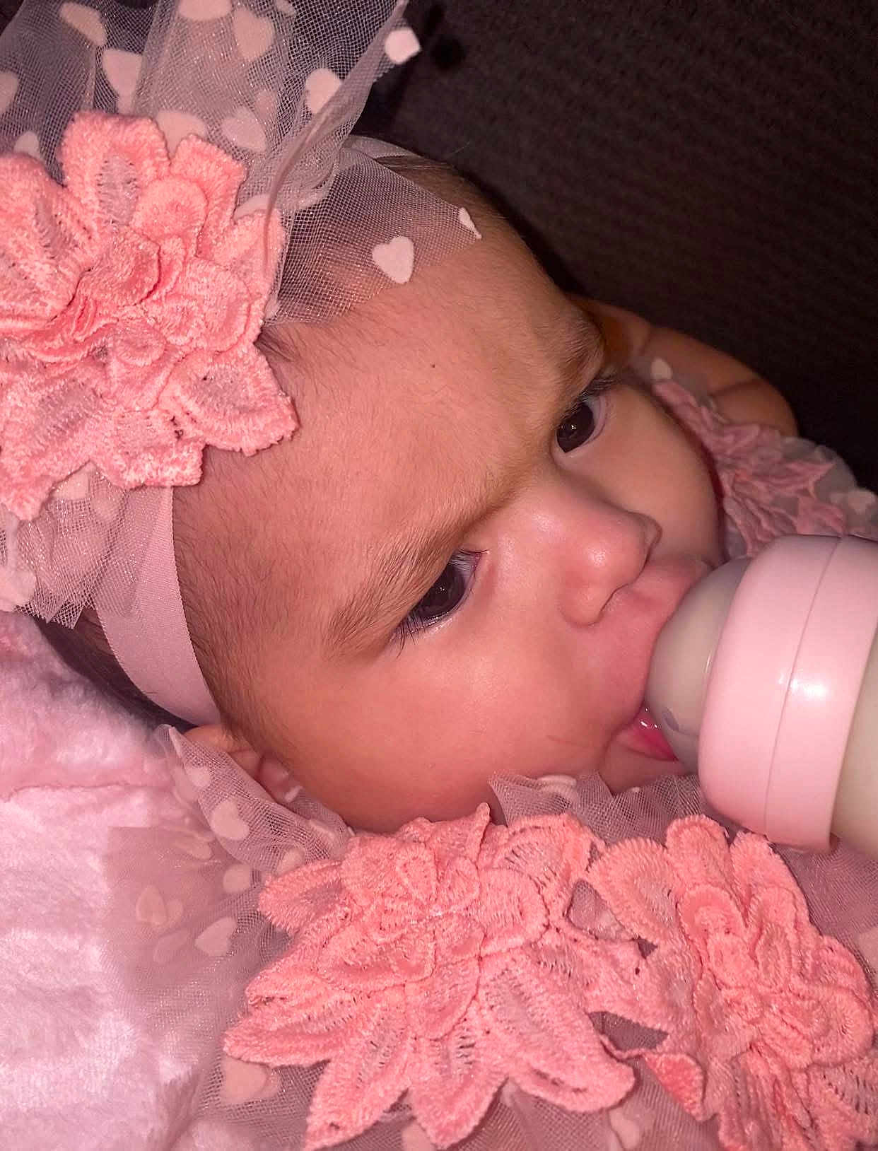 Avia is registered to the contest to win money with this photo: baby, bottle, feeding, headband, pink, lace, flower, closeup, infant, cute, child, face, portrait, soft, fabric, young, skin, eyes, mouth, clothing