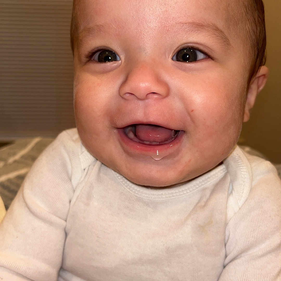 Leonardo is registered to the contest to win money with this photo: baby, babylaughing, bodypart, face, happy, head, laughing, mouth, newborn, person, photography, portrait, sitting, smile, teeth, tongue