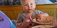 Summit joined the competition — help win amazing prizes! toddler, child, messy_face, chocolate, plate, cake, table, elderly_person, hand, nail_polish, food, indoor, wooden_table, curious, sitting, person, face, meal, family, bonding
