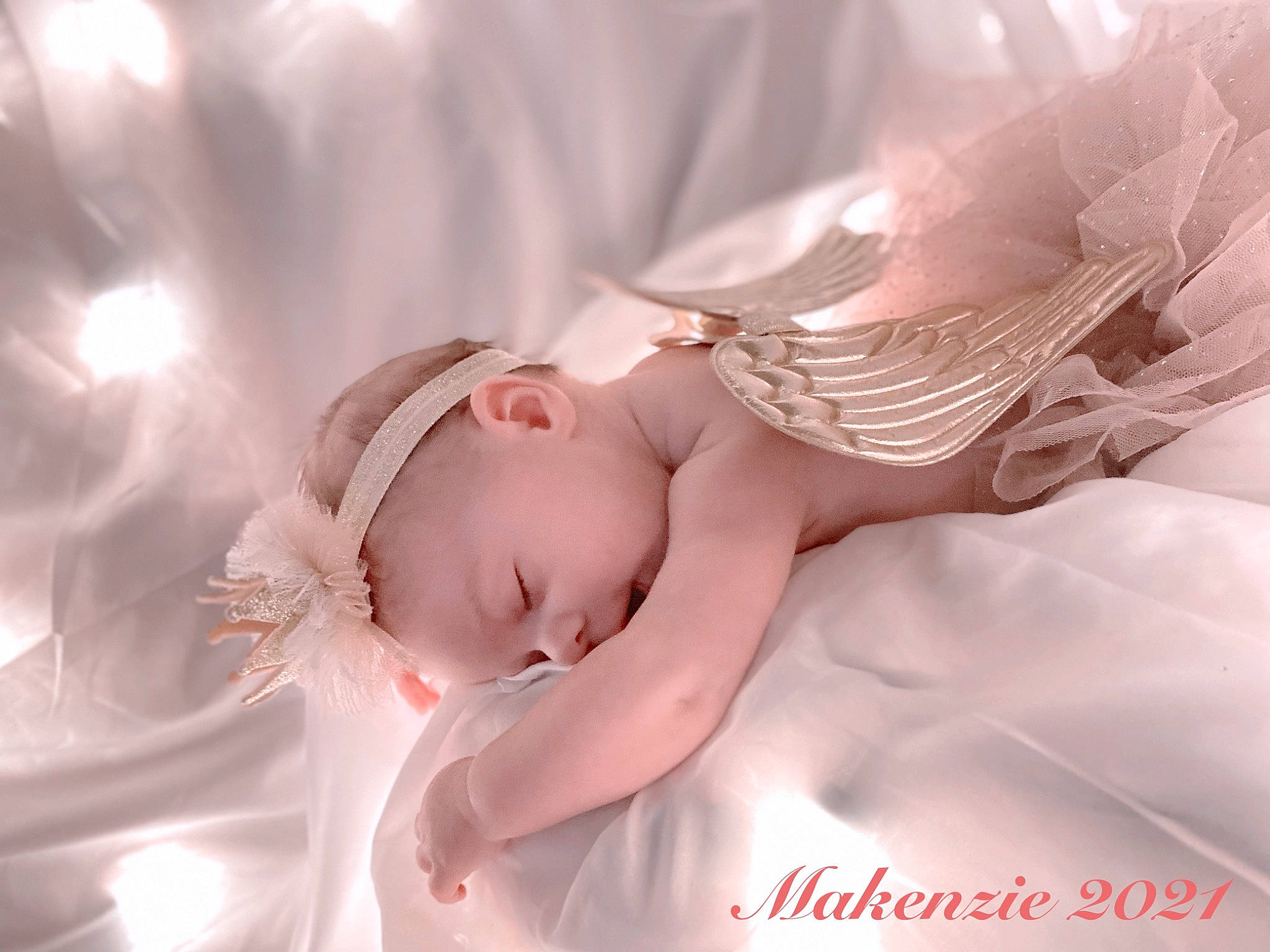 Makenzie is registered to the contest to win money with this photo: angel, bed, bridal_accessory, close_up, doll, dress, ear, eye, eyelash, face, fashion_accessory, hair_accessory, headpiece, human_body, jewellery, lip, peach, person, petal, pink