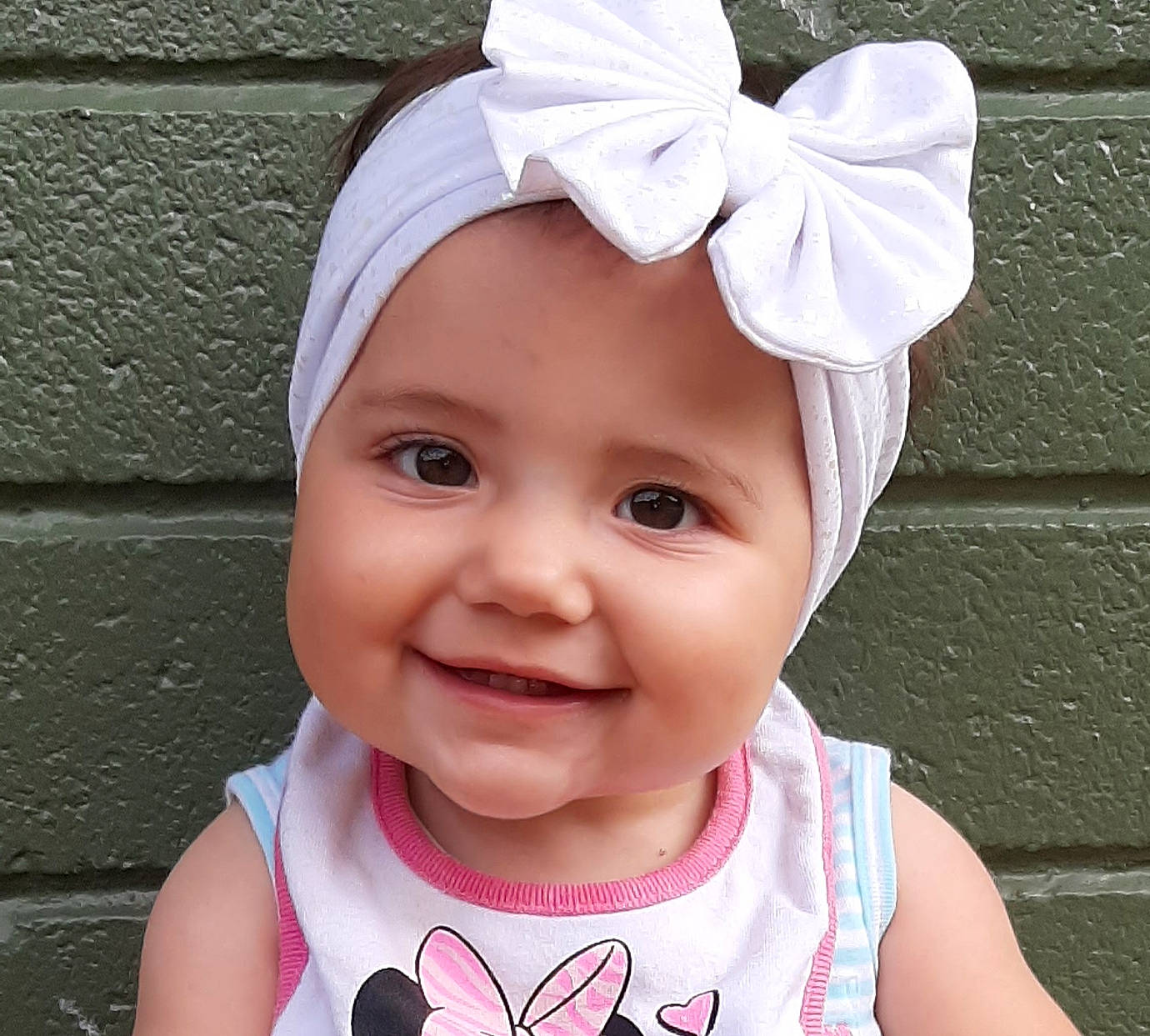 Alexis Rose Hill is registered to the contest to win money with this photo: baby, baby_toddler_clothing, bonnet, cap, cheek, child, clothing, cool, ear, face, fashion_accessory, hair_accessory, happy, hat, head, headband, headgear, headwear, joy, neck