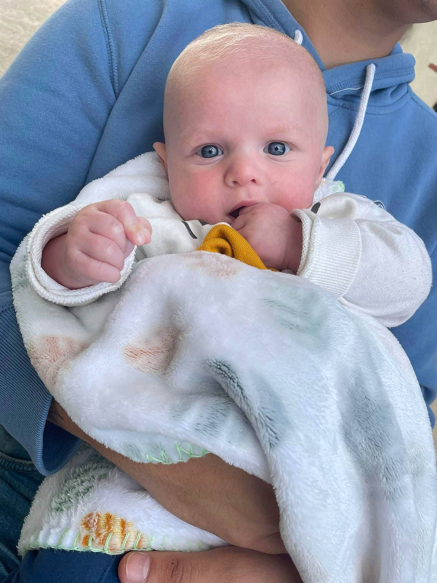 Noah participe au concours pour gagner de l'argent avec cette photo : baby, baby_products, baby_sleeping, baby_toddler_clothing, cheek, child, comfort, event, eyelash, finger, gesture, happy, linens, nail, person, sitting, skin, thumb, toddler