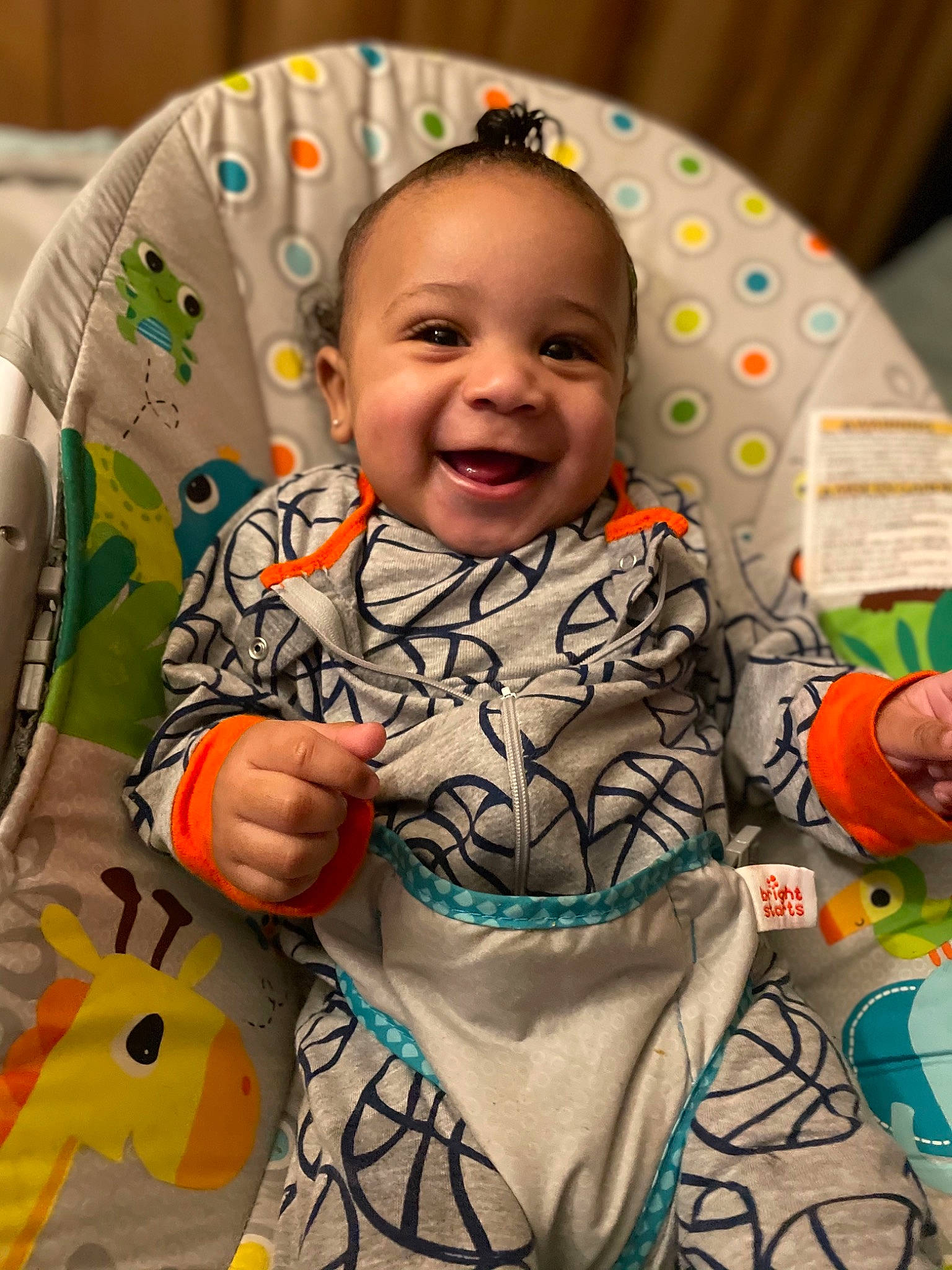 Bronx is registered to the contest to win money with this photo: baby, baby_toddler_clothing, cheek, dress, eye, face, facial_expression, happy, head, human, iris, joy, orange, organ, people, person, product, skin, sleeve, smile